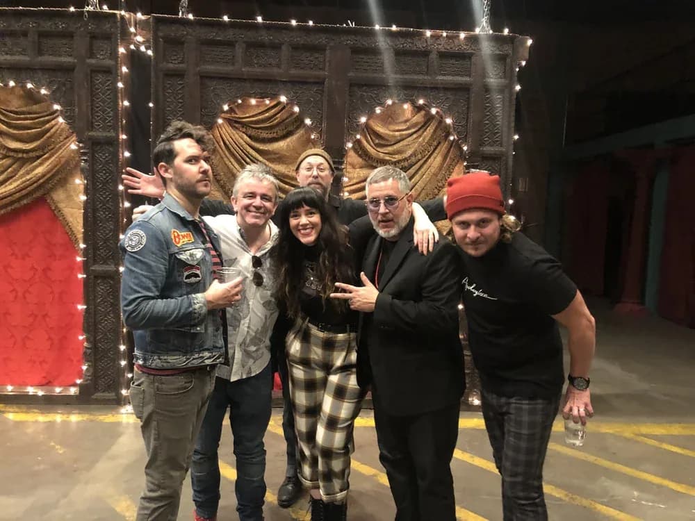 Tracy Vasquez backstage with Nick Arrojo and fellow platform educators after a show.